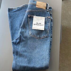 rag & bone Men's Slim Straight Jeans in Medium Blue with Tan Patch